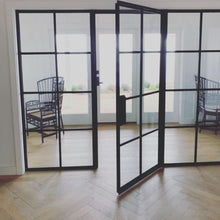 Load image into Gallery viewer, A sunny room with interior sidelights and modern steel single door