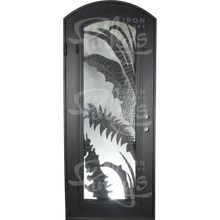 Load image into Gallery viewer, Single exterior door made with a thick iron frame and a full panel of glass behind palm-leaf cutouts. Door is thermally broken to protect from extreme weather.