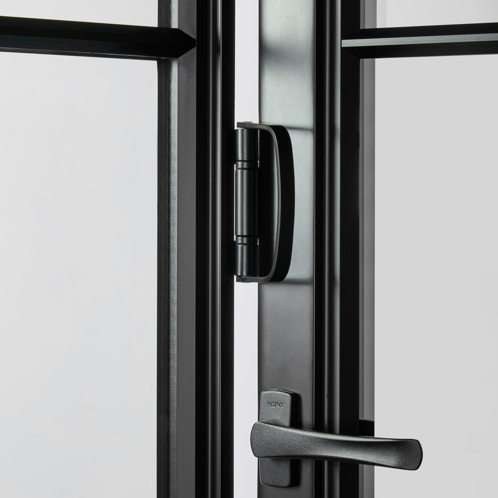 closeup detail of steel bi-fold accordion hardware