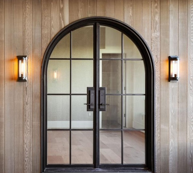Steel entry door with divided lights and contemporary architectural styling