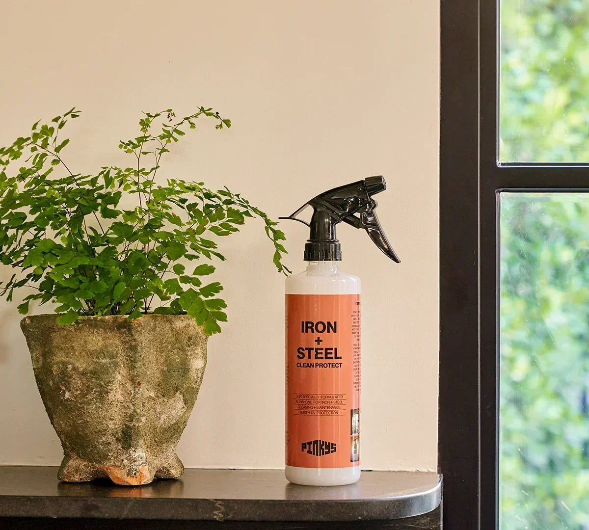 closeup image of PINKYS clean and protect iron door spray