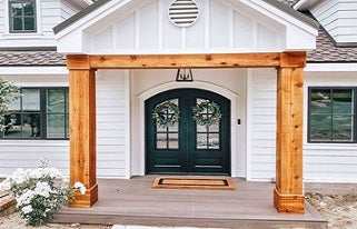 fall-themed black steel doors with wooden beams