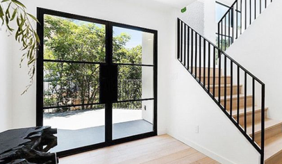 French doors next to a staircase
