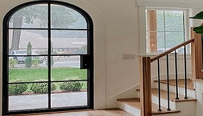 interior entryway featuring iron French doors