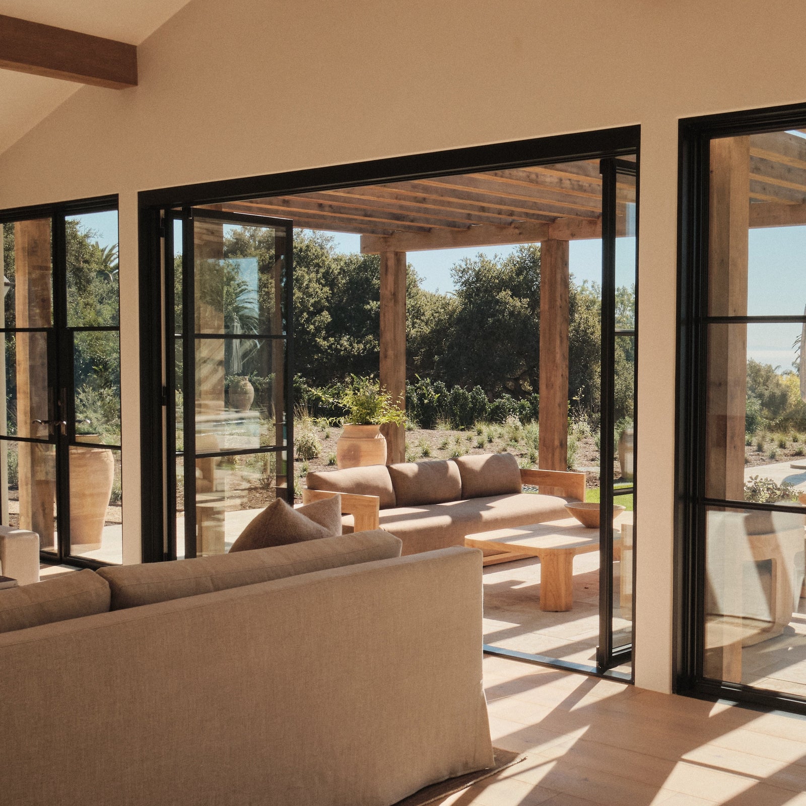 Architectural steel door with large glass panes and narrow steel grid