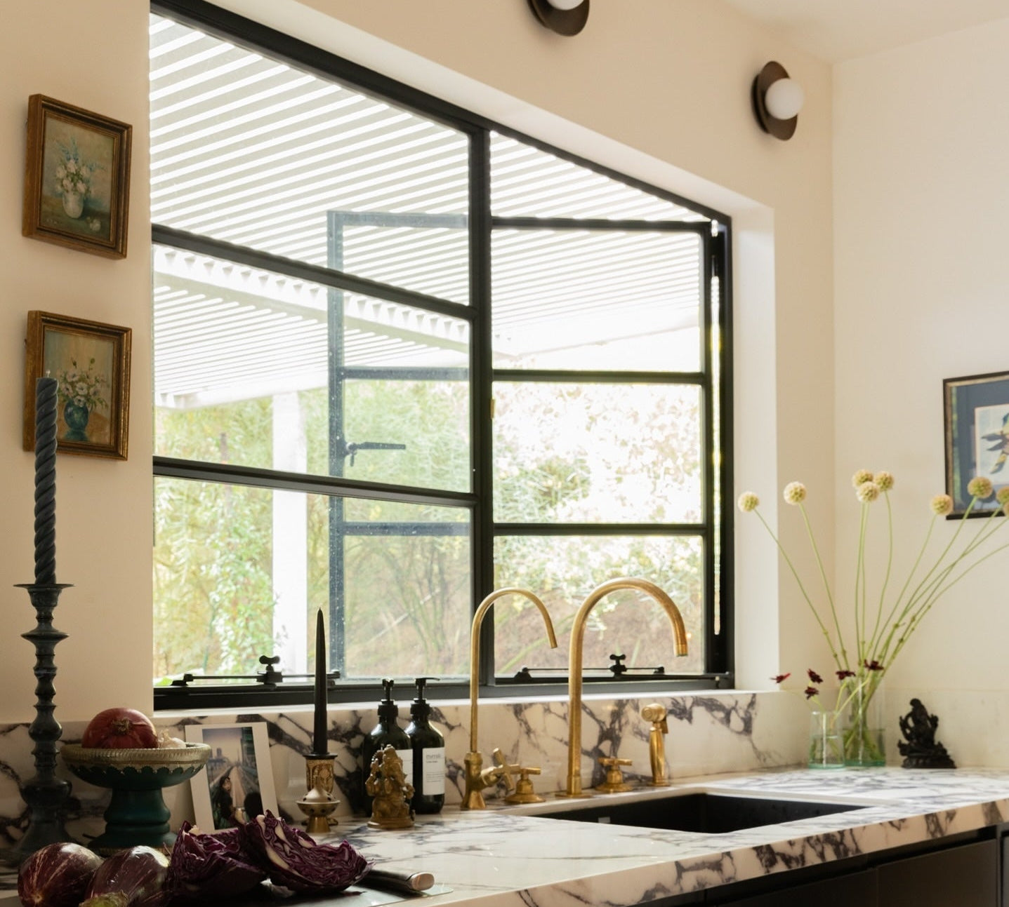 Contemporary steel double casement window with large glass panel and sleek frame