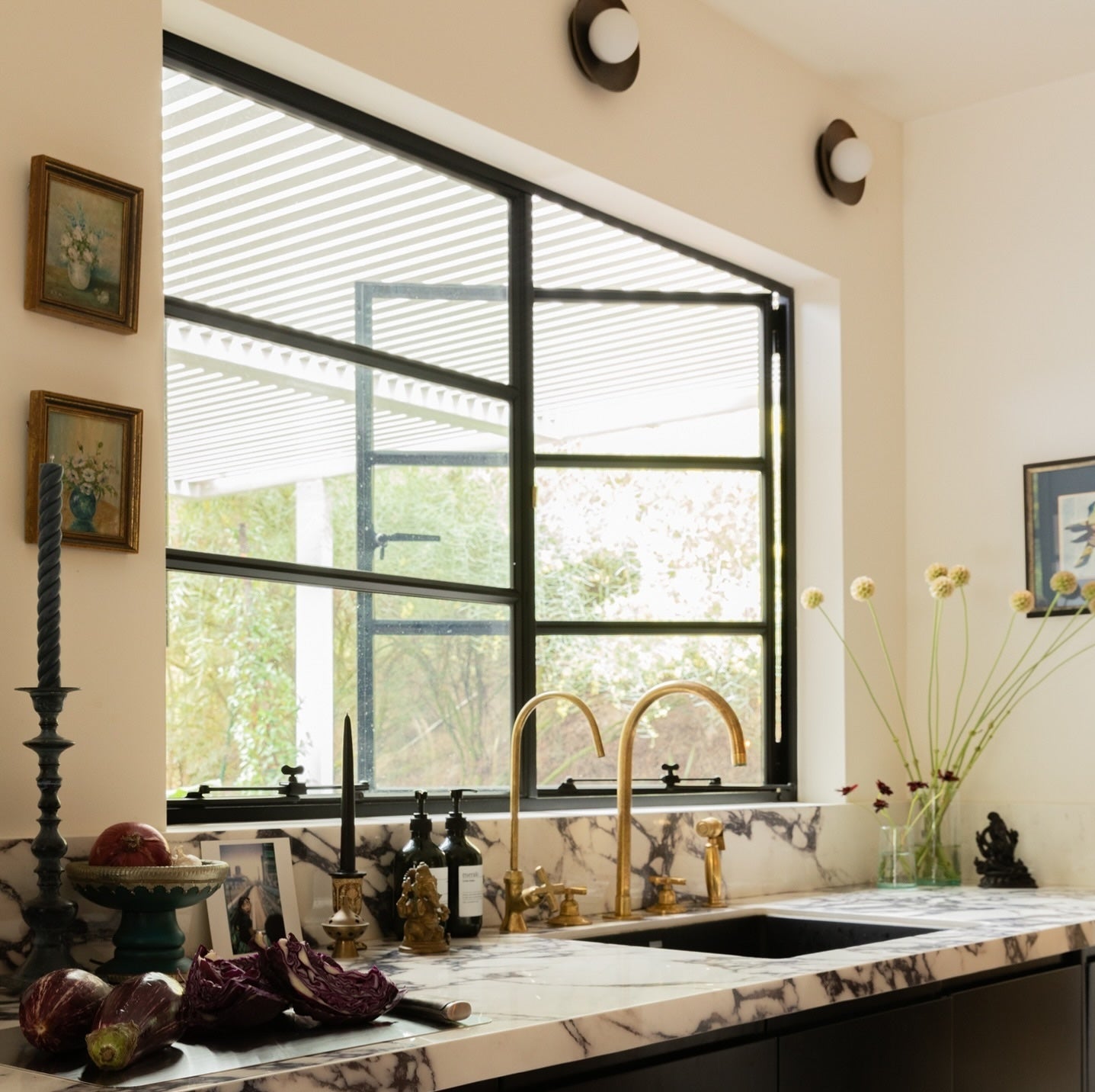 Contemporary steel double casement window with large glass panel and sleek frame