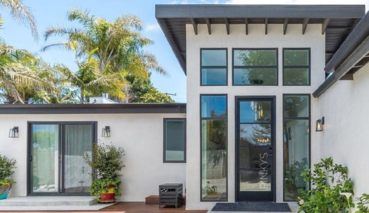 modern iron entry doors installed in a stunning property