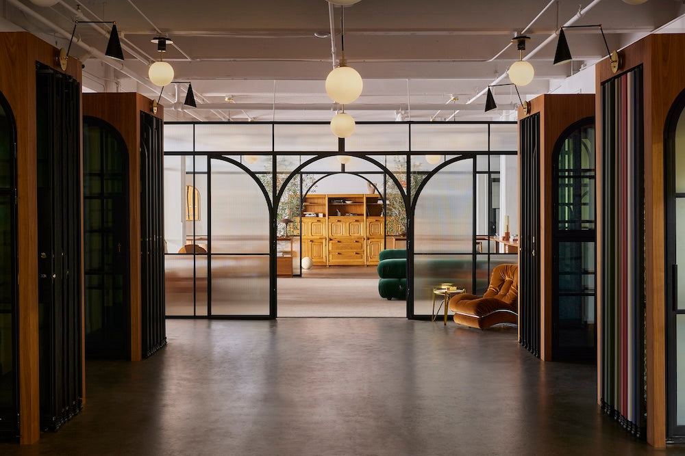 Dramatic showroom photo with double air grand full arch interior doors