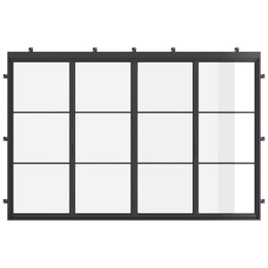 Simple black 4-panel steel bifold doors in garden setting