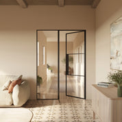 Interior steel sidelight window with narrow sightlines and minimalist frame