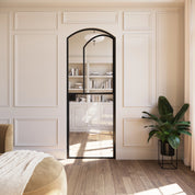 Solid steel Dutch door with arched top and clean modular construction.