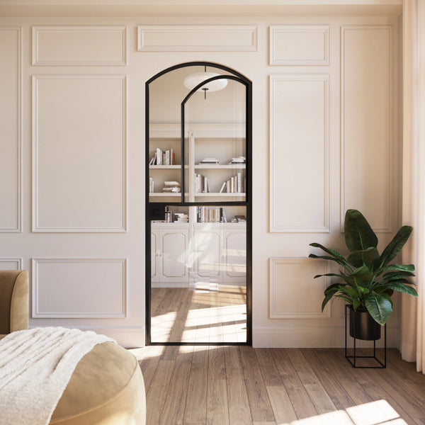 Solid steel Dutch door with arched top and clean modular construction.