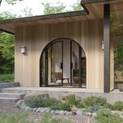 Paired full arch steel entry with side windows.