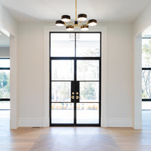 Load image into Gallery viewer, Airy entryway featuring double steel doors with a flat top window