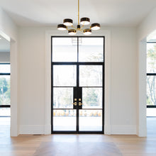 Load image into Gallery viewer, Double steel doors with a flat top transom in a sunny entryway