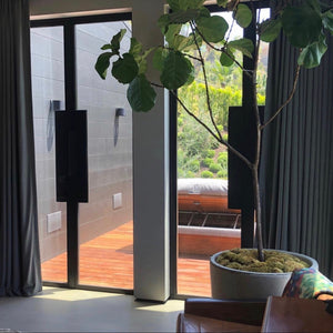 Super minimalist glass and steel double doors on a tropical home