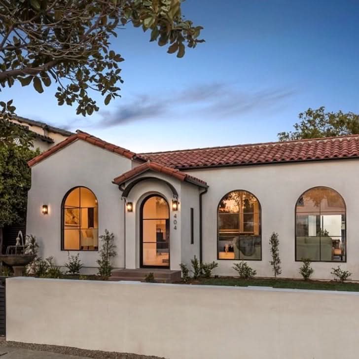 Modern, Minimalist Arch Top Windows in the front of a traditional California Spanish-style home