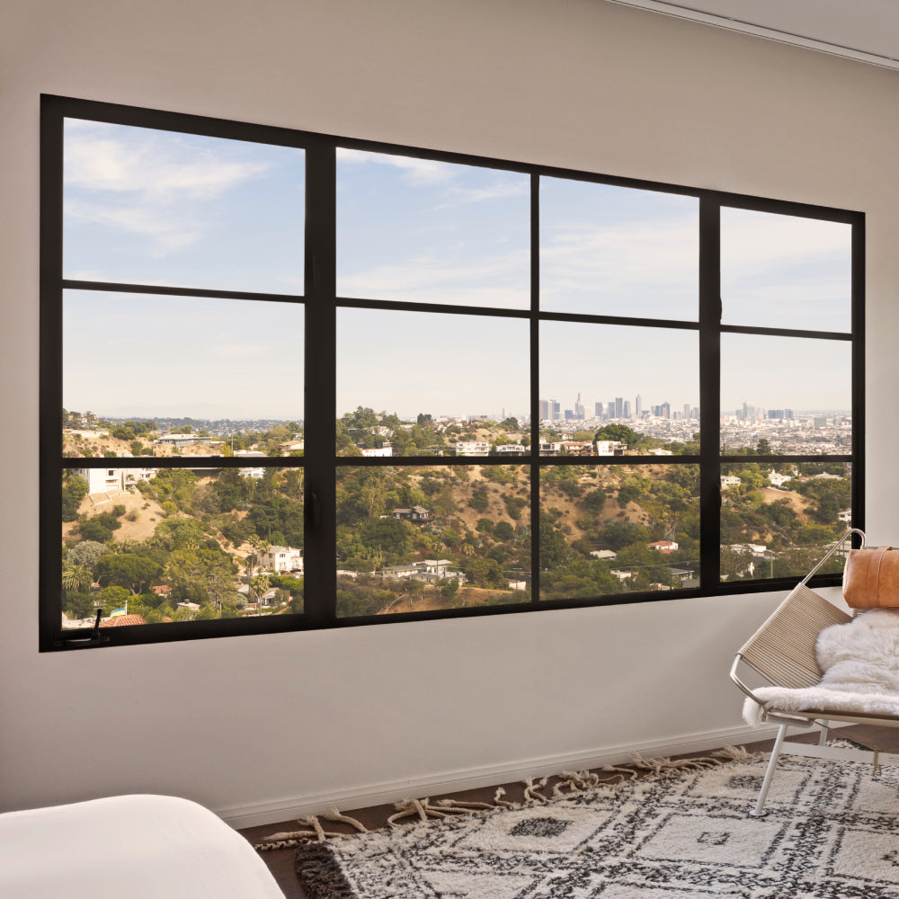 Landscape dual casement window with a fixed panel in the middle