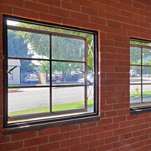 Distinctive push out windows looking out from brick interior