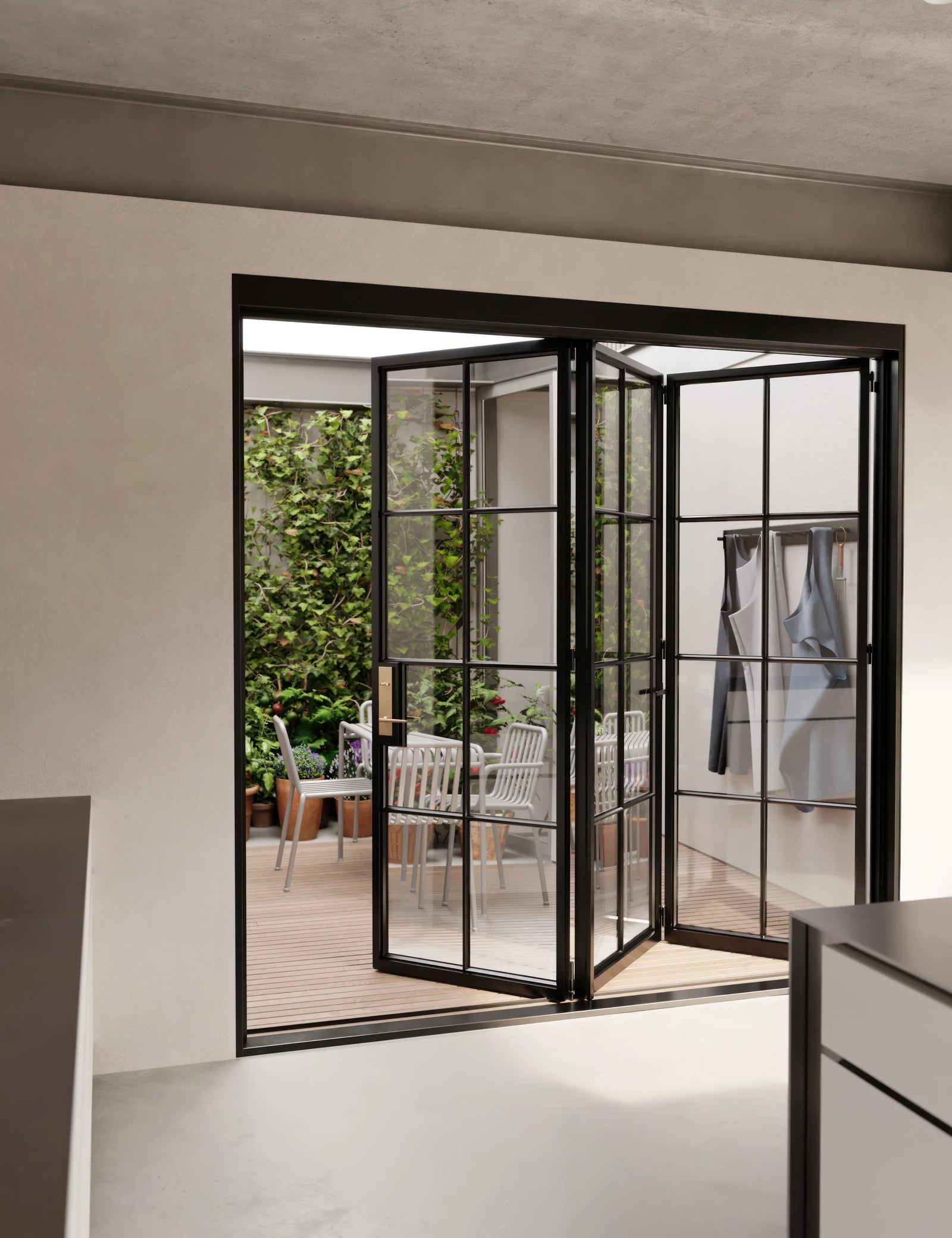 exterior folding door with thermal barrier construction