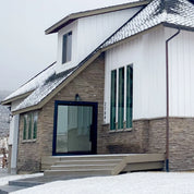 Flat pivot steel door with precision hardware.