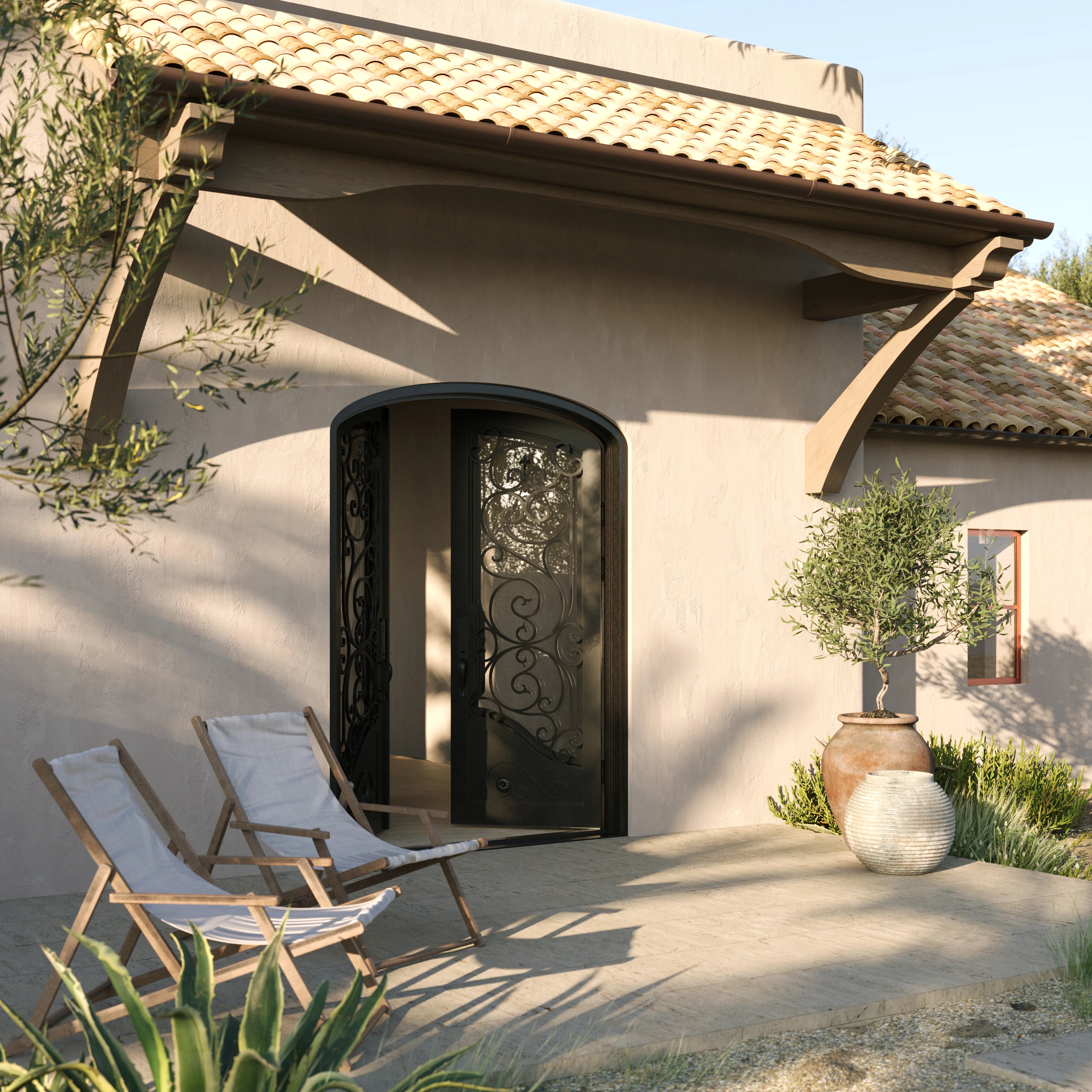 Beverly arched iron entry door with glass in bronze tone.