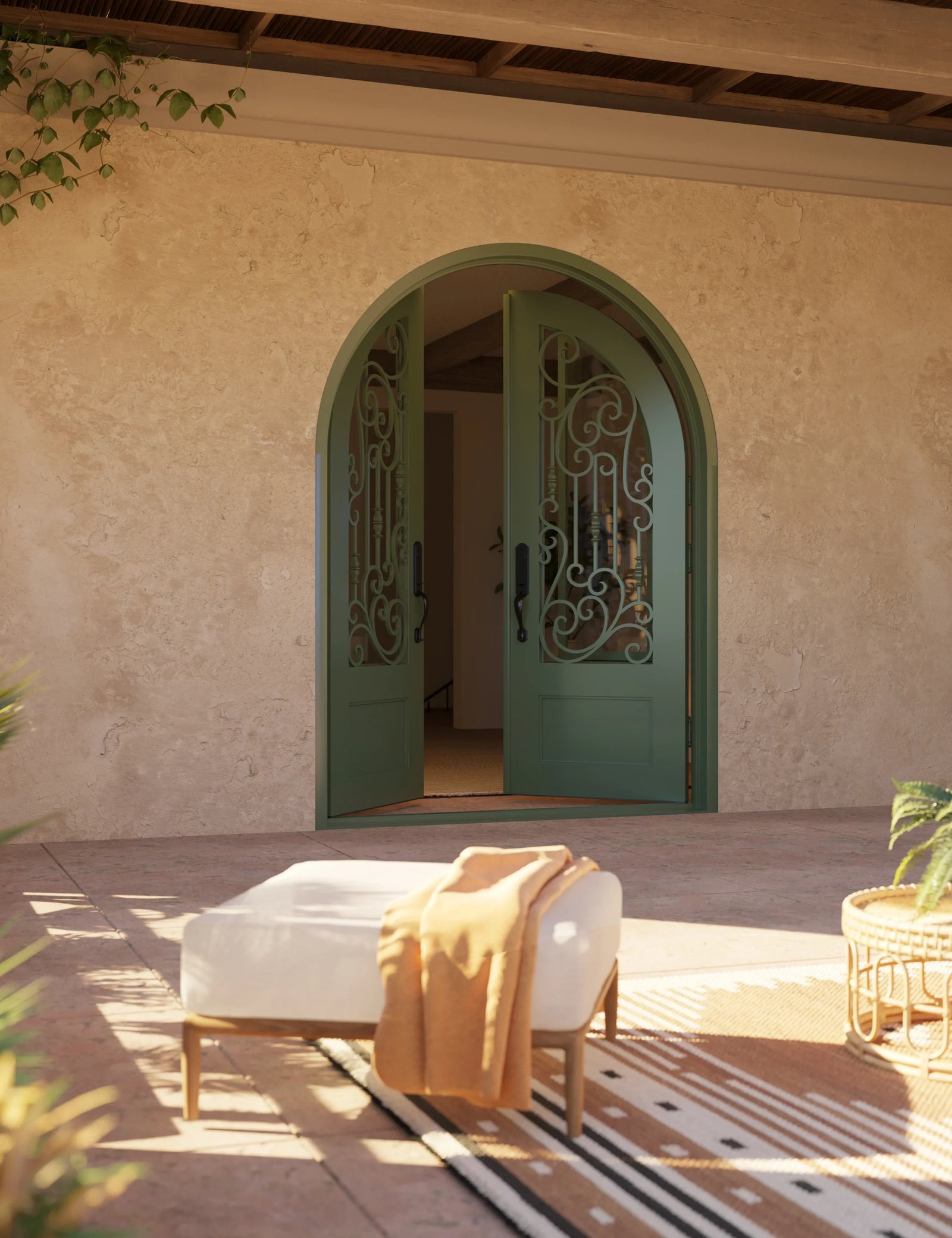Golden Gate round top iron door in bronze for cold weather.