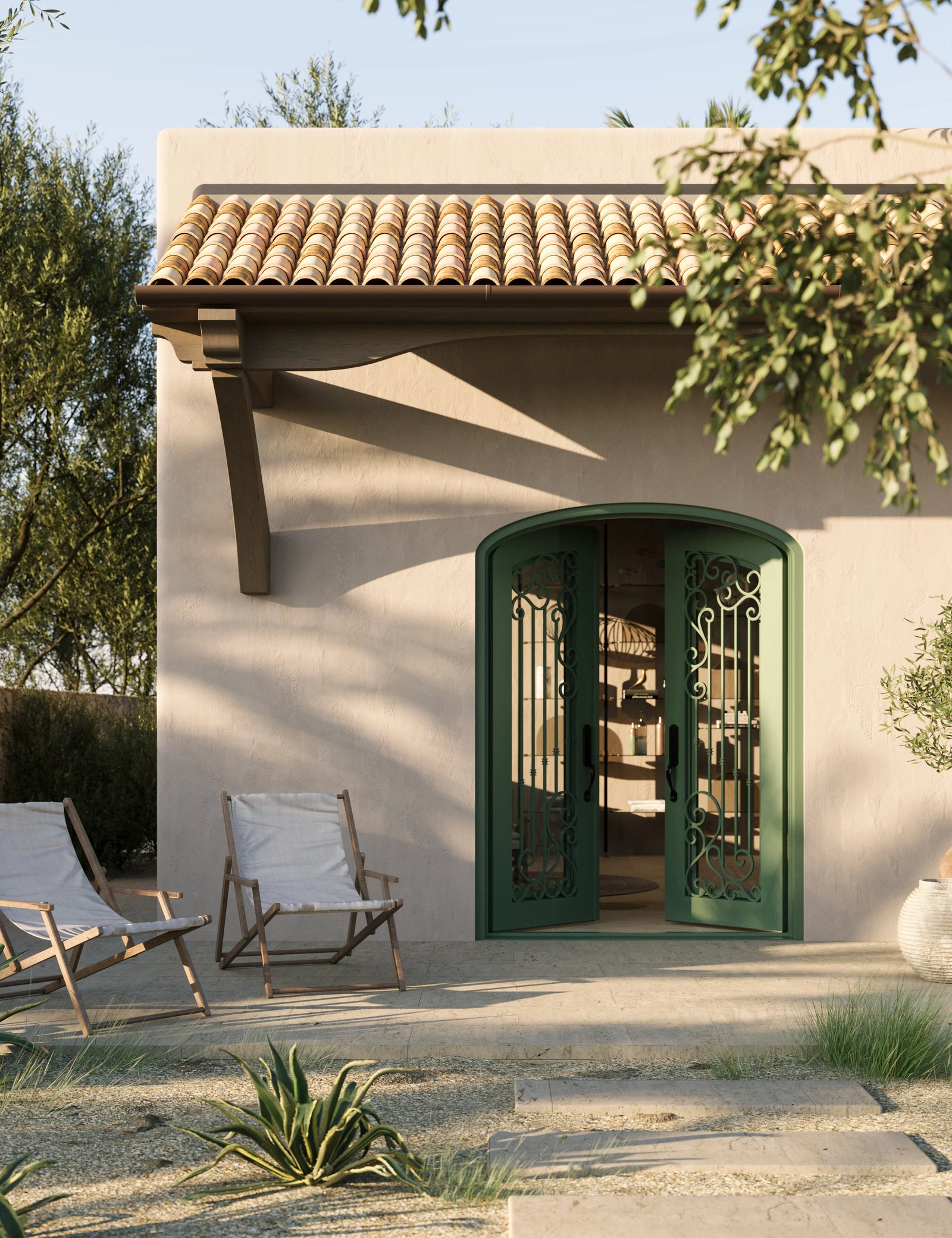 Paris iron entry door in bronze shade with glass windows and arched entry.