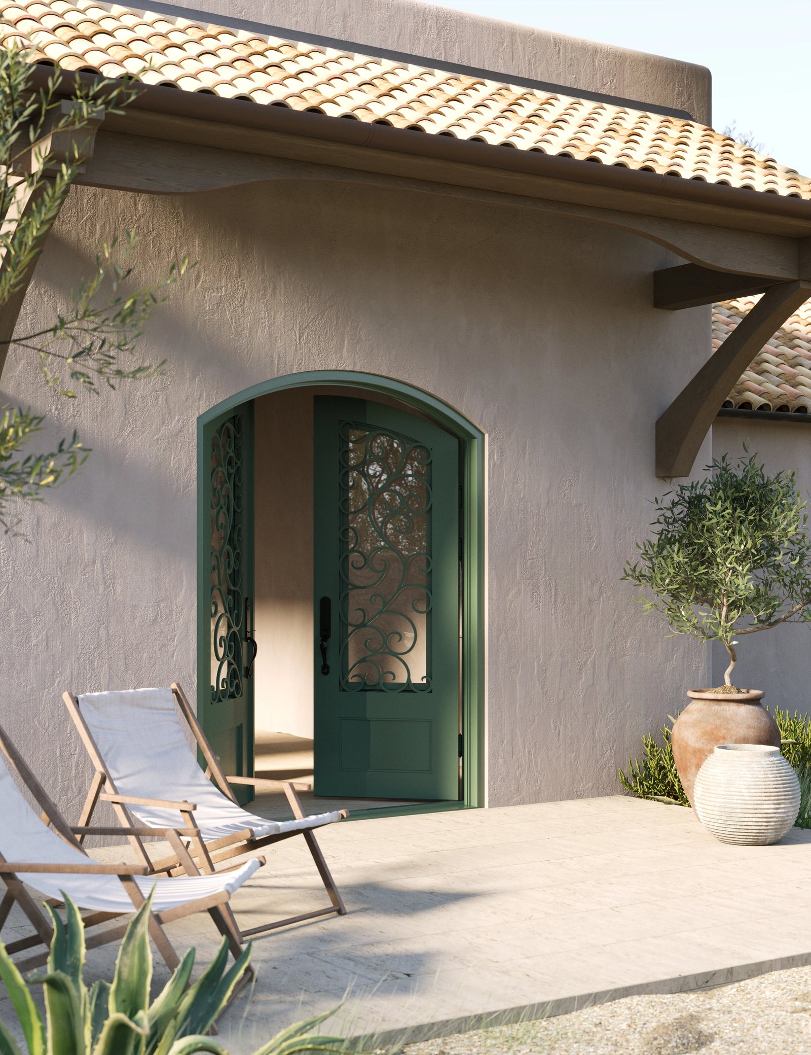 Story arched entry double iron door in bronze finish with glass.