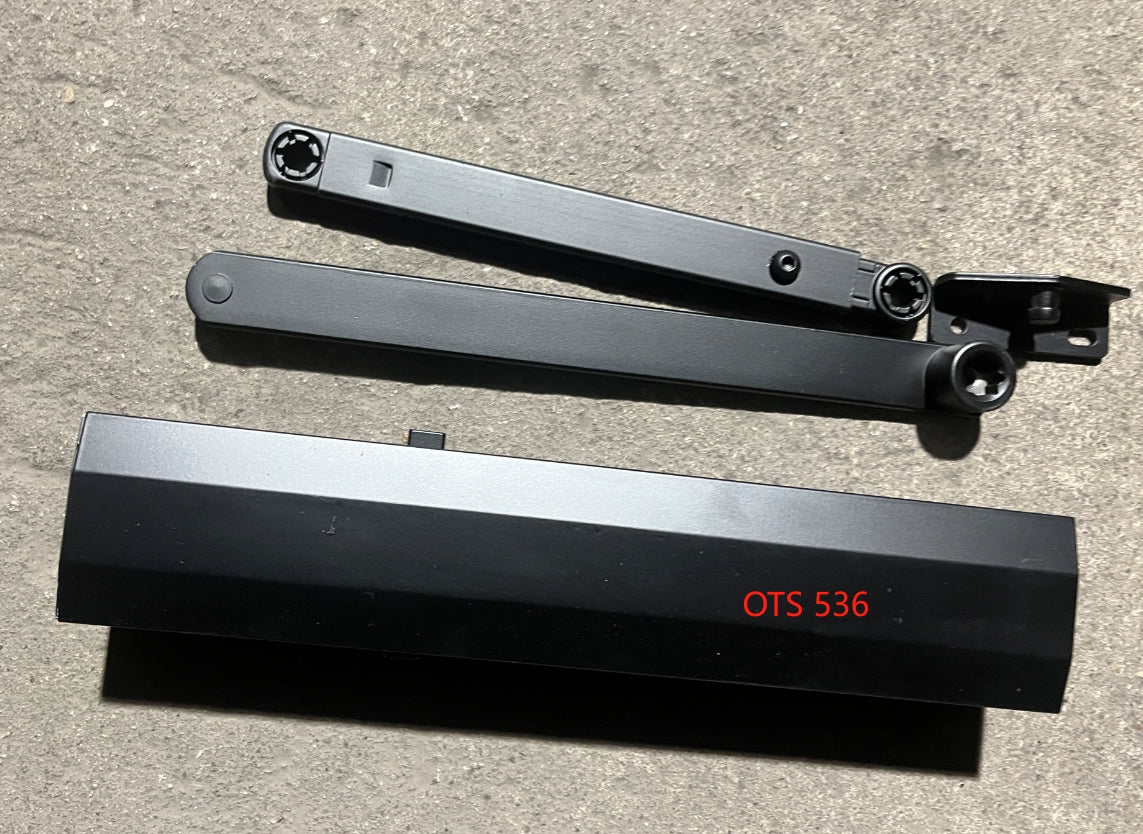 Self closing hardware for storefront entry door with hydraulic arm.