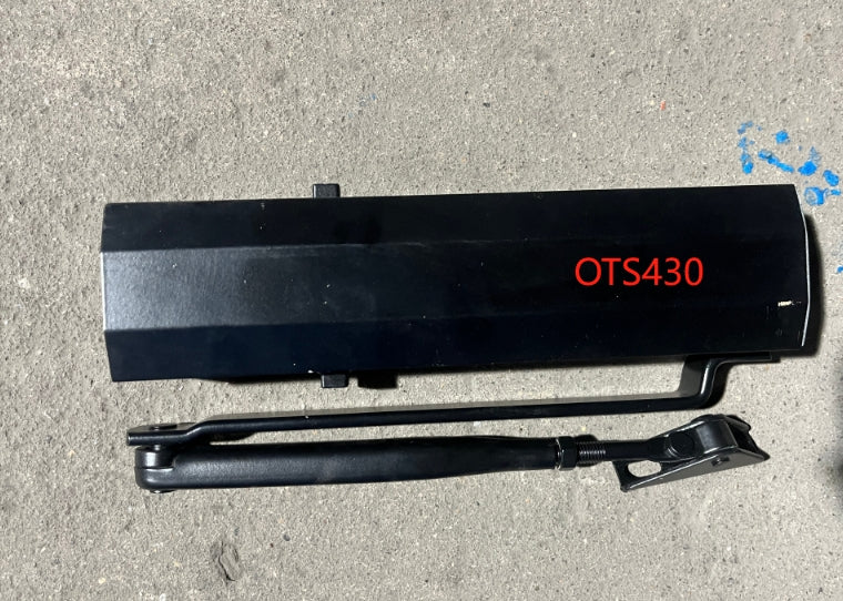 Self closing arm for steel entry door in black.