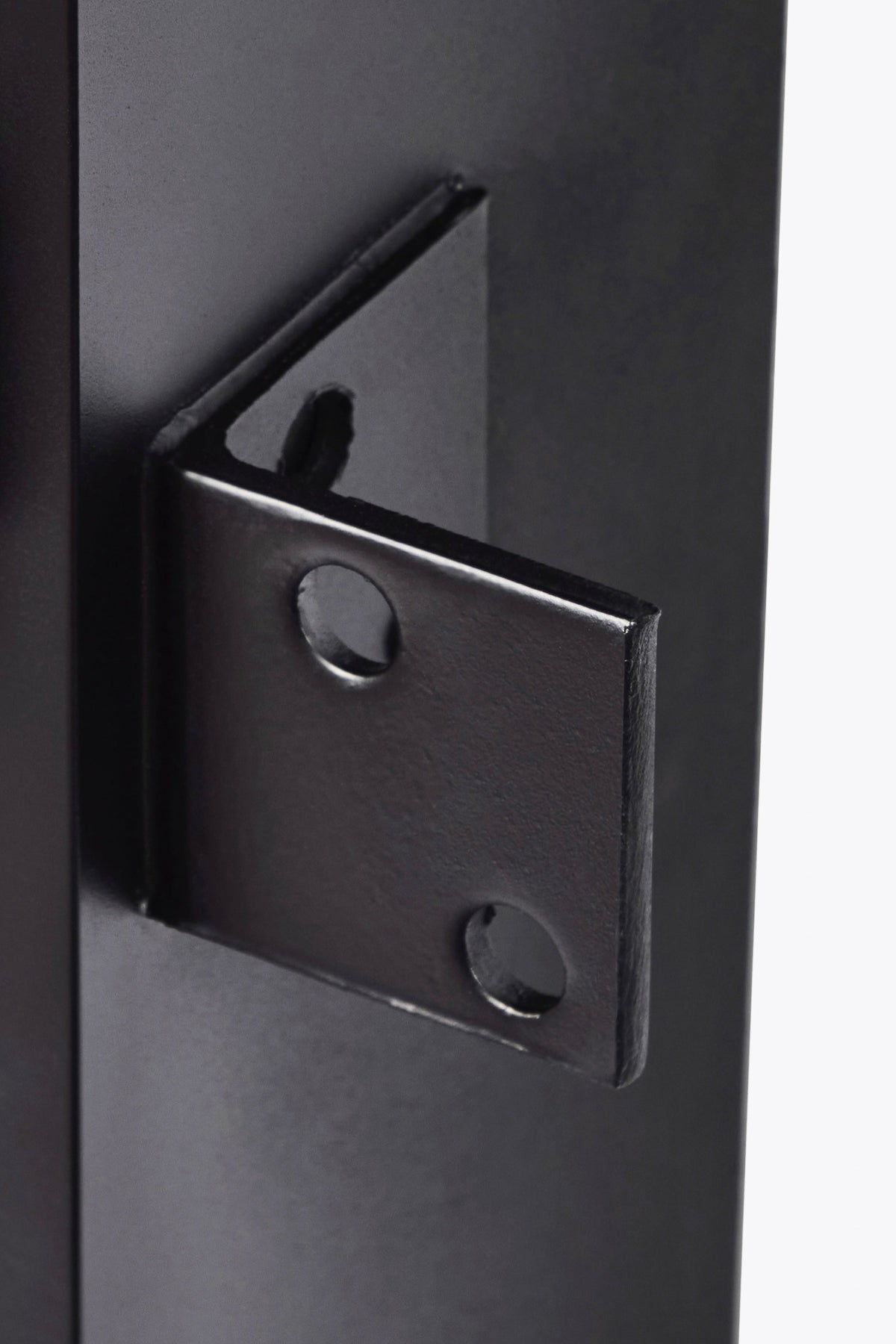 Closeup of finished steel door mounting tabs