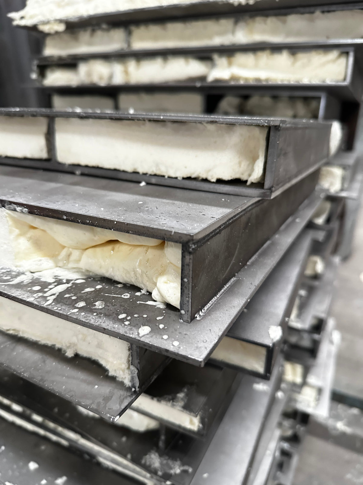 Closeup of unfinished steel door frame filled with foam