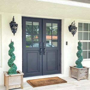 Double exterior doors made for an entryway with a thick iron and steel frame and two 6-paned windows. Doors are thermally broken to protect from extreme weather.