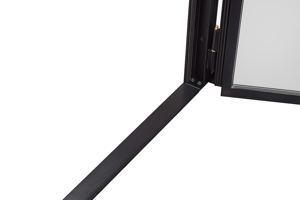 Closeup photo of an interior steel door threshold