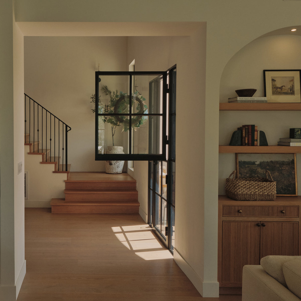steel dutch door with side windows in contemporary home