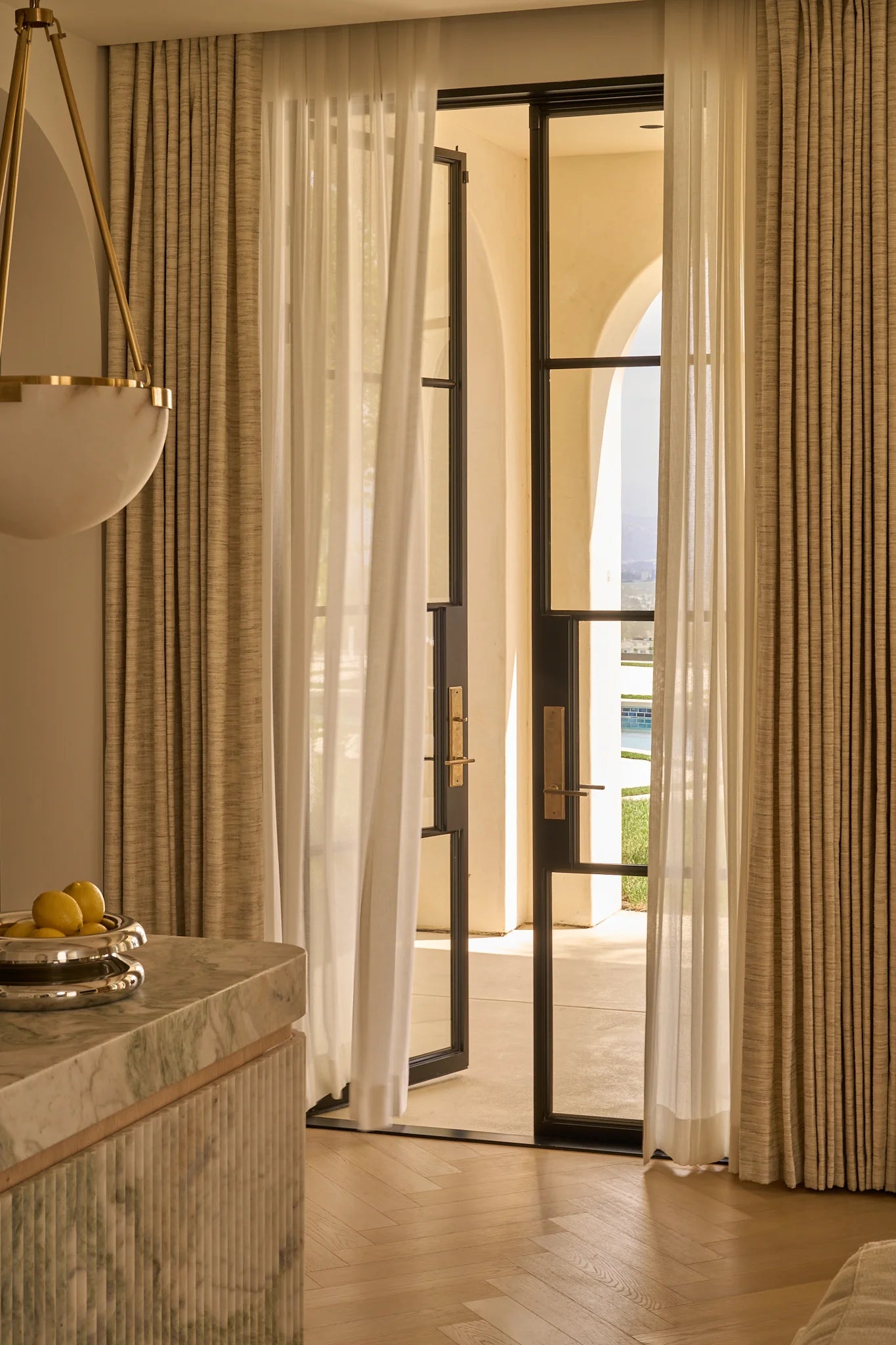 tall double steel french doors in black in a luxury home