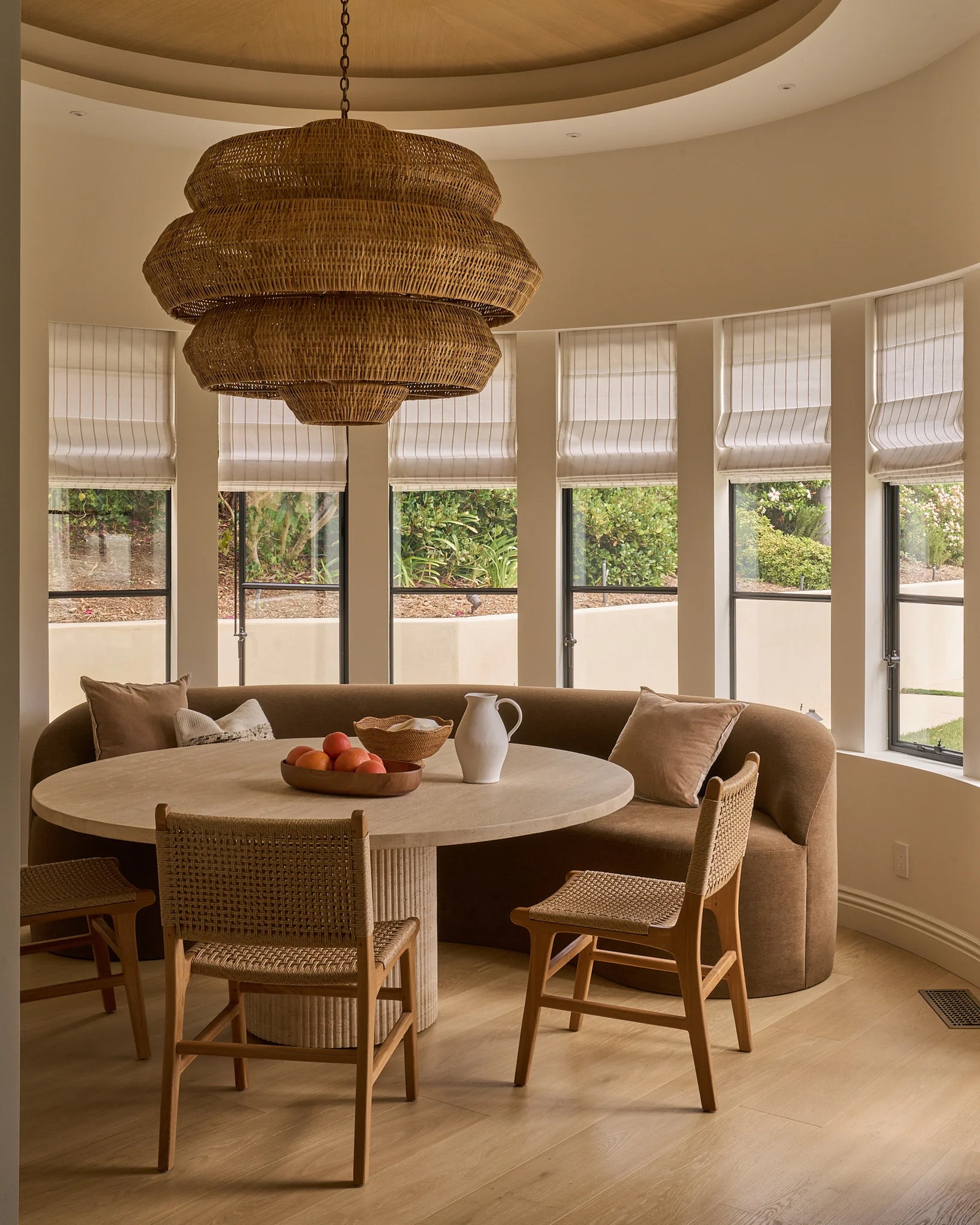 a high end luxury dining room encircled by a series of single casement steel windows