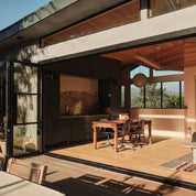 Architectural steel door with oversized glass panes and slim steel construction