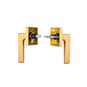 PINKYS privacy lever in brass with square escutcheon and modern lever style.