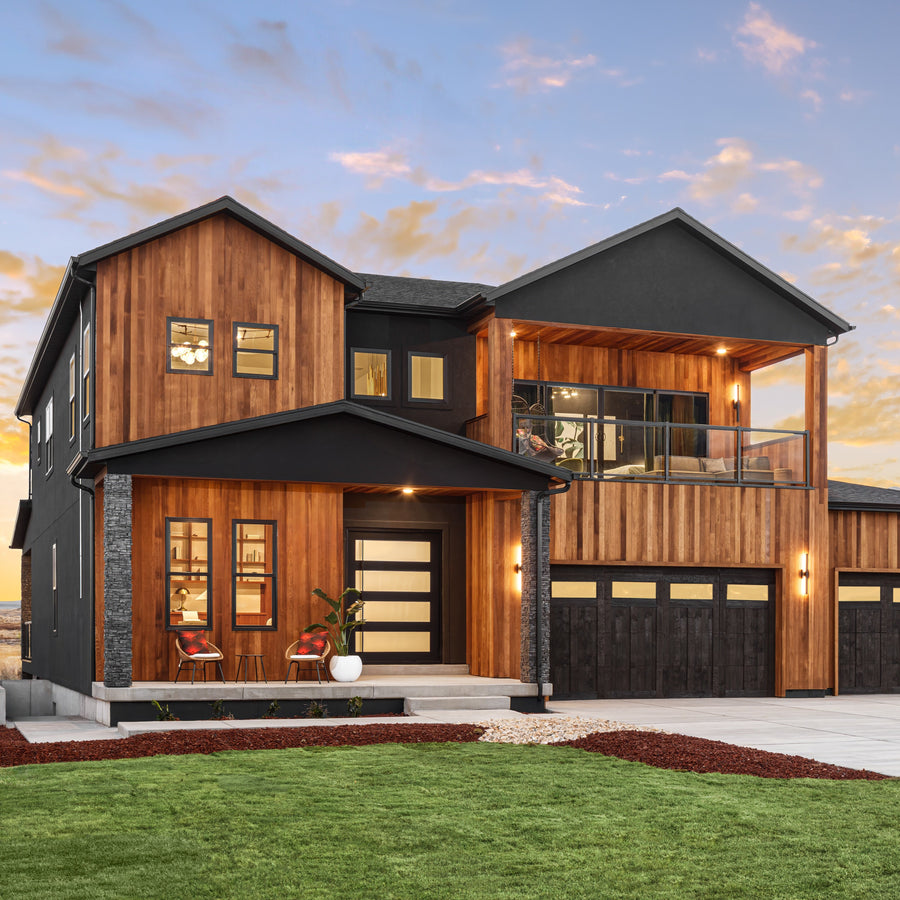 PINKYS steel and glass front door on a contemporary Nashville Tennessee home with brick and stone exterior in a tree-lined neighborhood