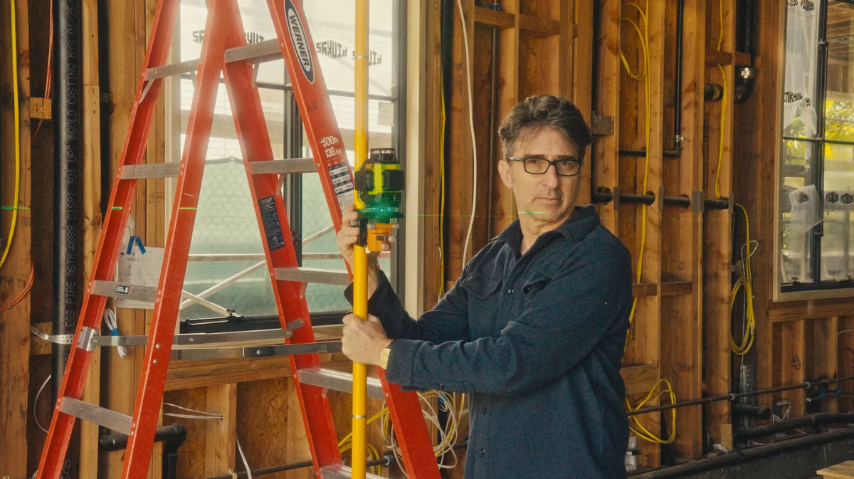 portrait of installer on job site installing steel casement windows