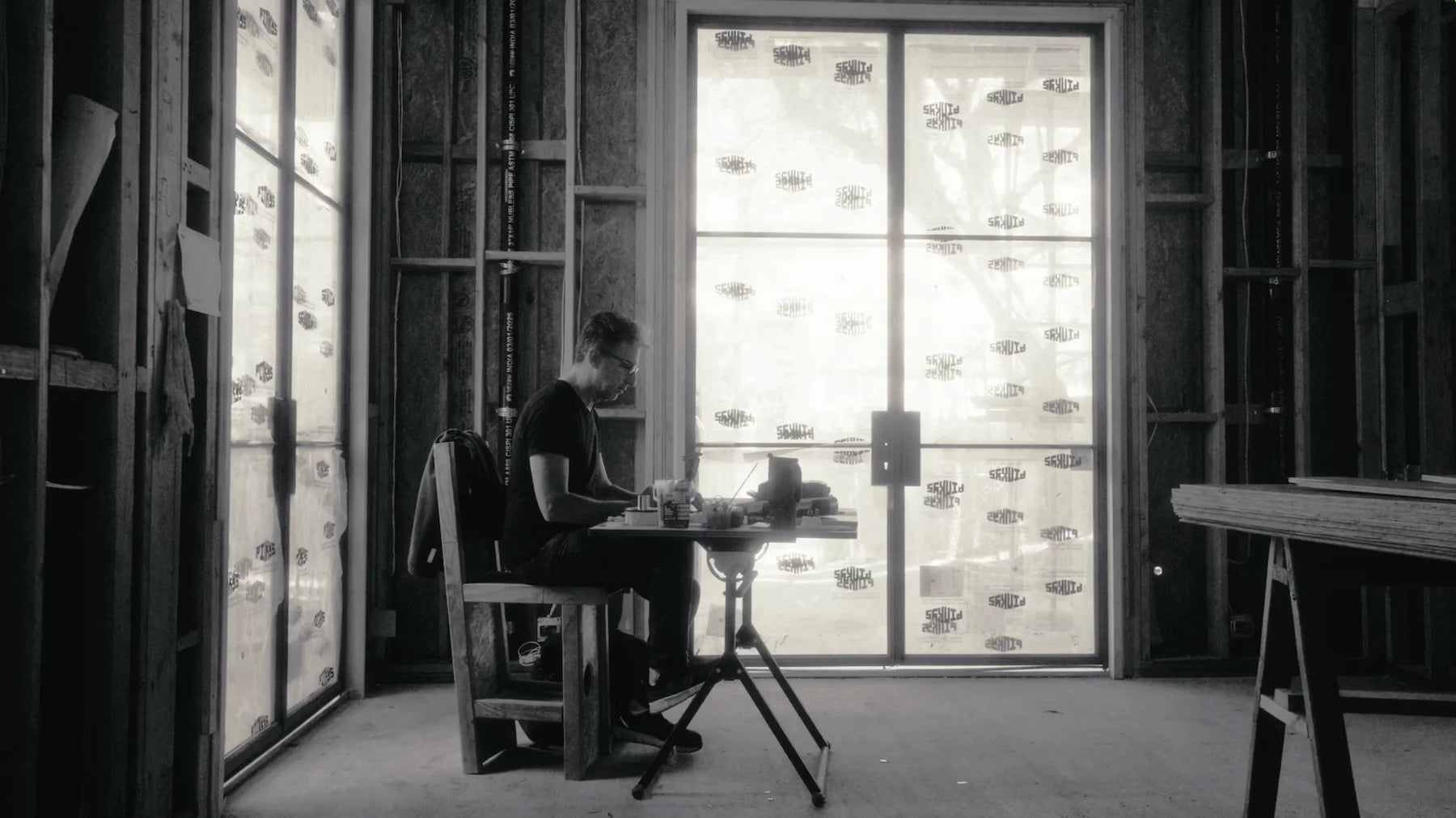 man working on site installing steel doors