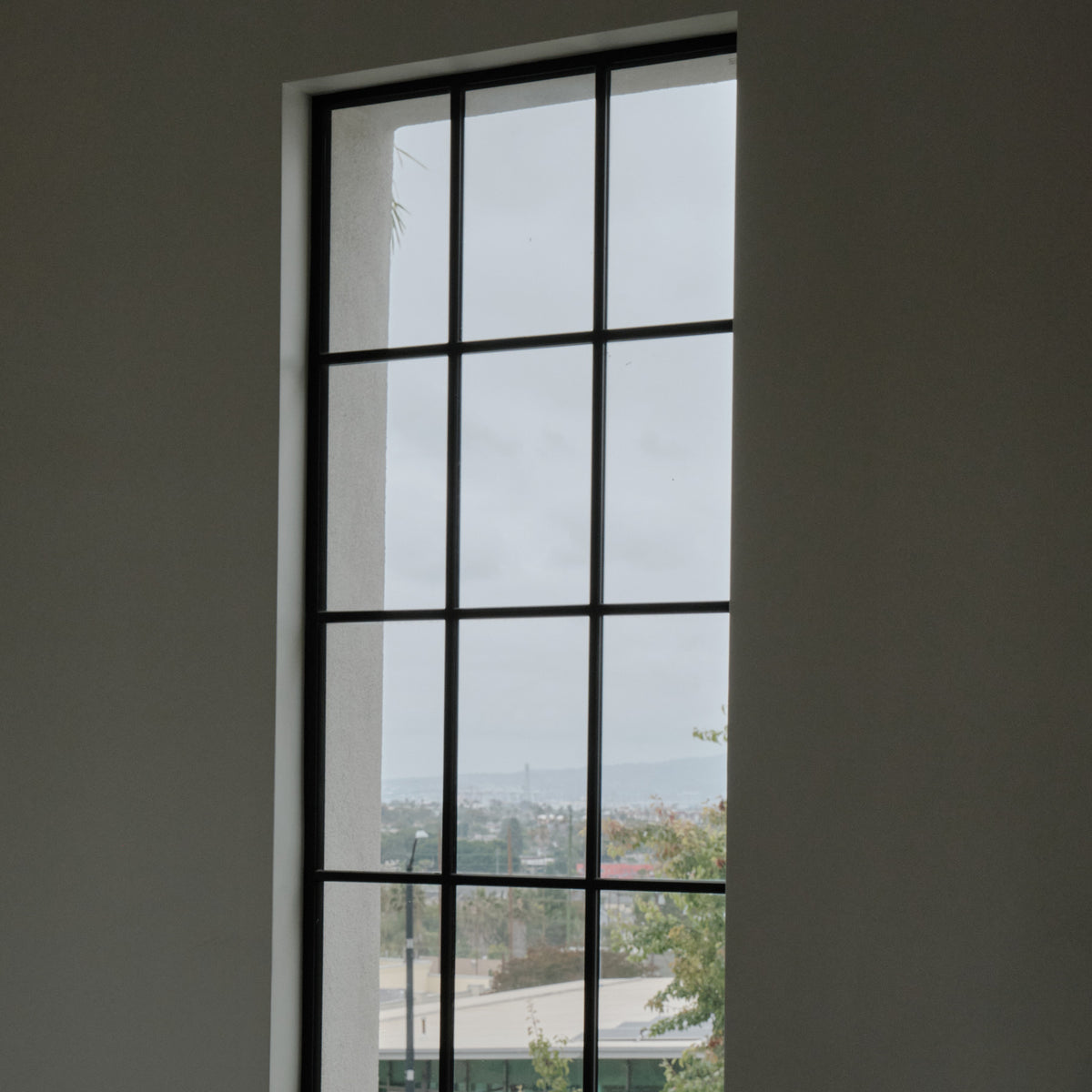 interior view of large format historic steel fixed window installed at Signal Hill City Hall