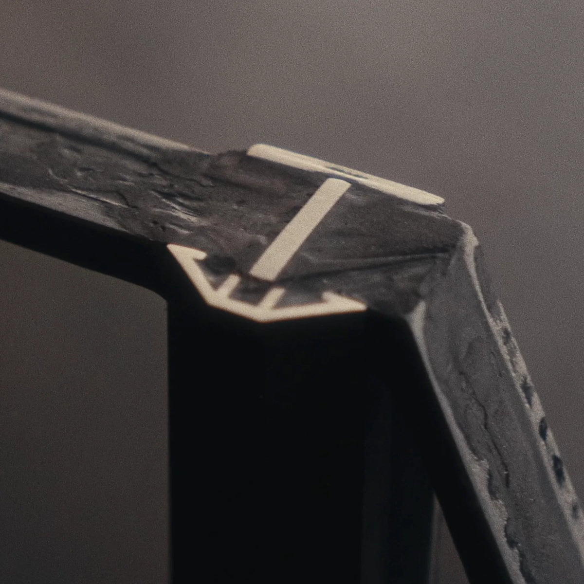 closeup of steel window corner showing push bead and t-bar details
