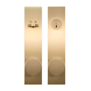 PINKYS lock with round knob and interior thumb turn deadbolt in brass finish.