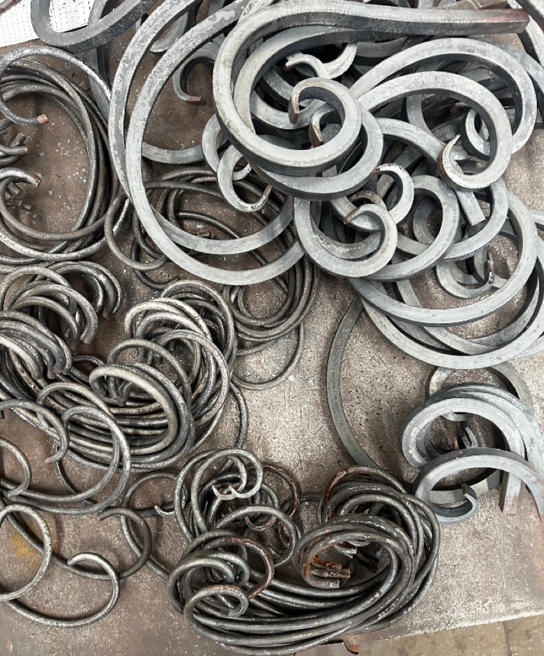 Photo of unfinished iron scrollwork for iron doors