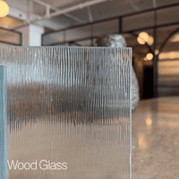 Wood glass sample pane in a modern indoor setting with blurred background