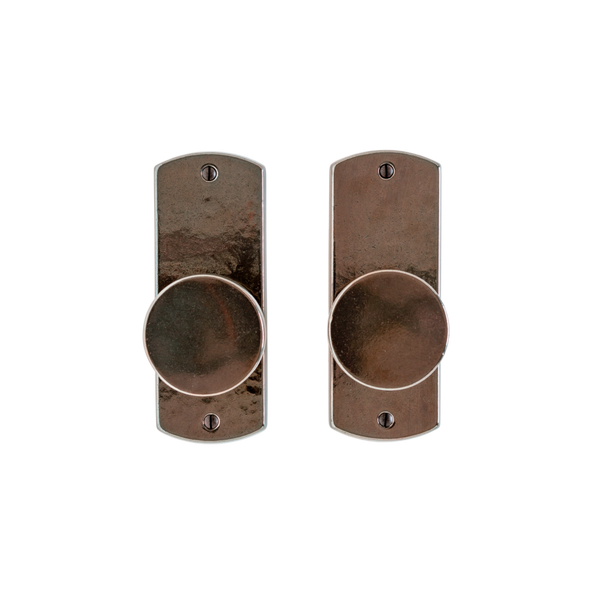 Bronze rocky mountain curved passage handle with living finish.